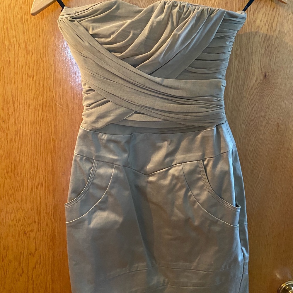 Bebe mini beige dress with pockets.